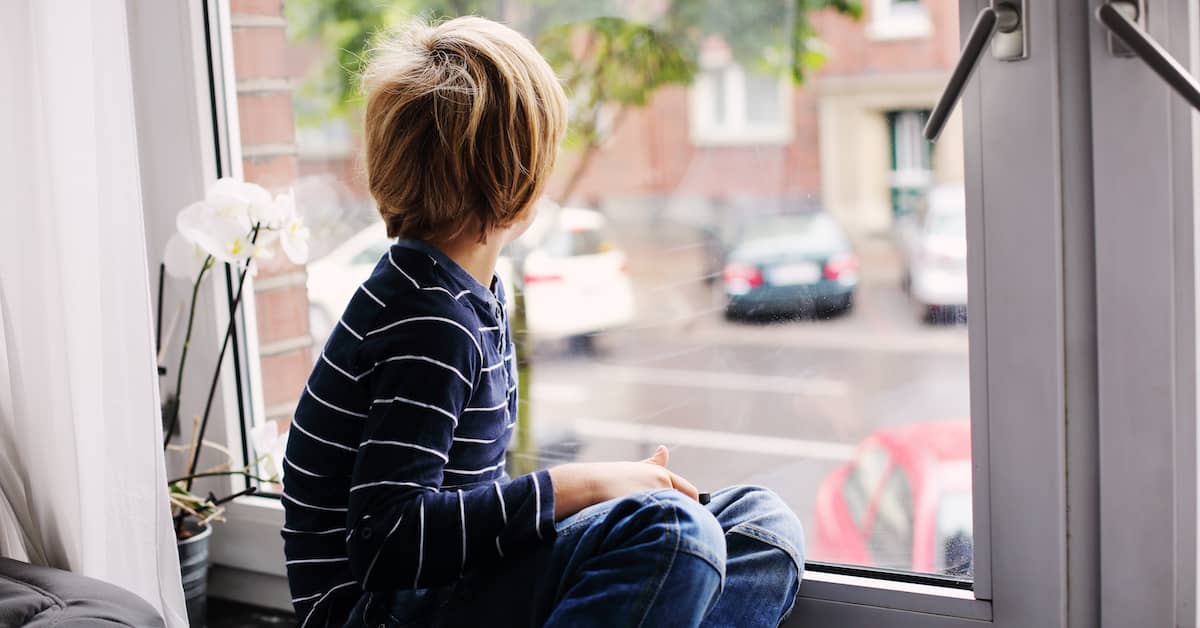 a child looks out a window on a rainy day | Fuller and Fuller, Attorneys PLLC