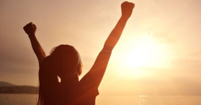 Woman with arms lifted in victory. Adults over 21 can now sue foster parents who abused them as children in Washington.
