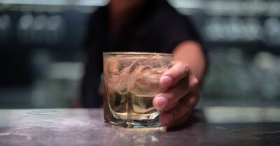 Bartender serving a drink