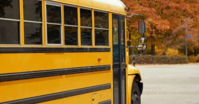 School bus and fall leaves